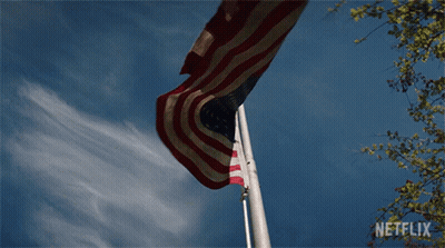 Man With Wig And Sunglasses In Corner GIF