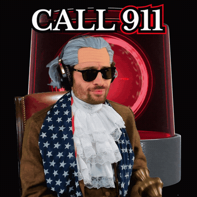 Man With Wig And Sunglasses In Front Of Call 911 Sign GIF