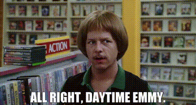 Man With Wig In Front Of Action Sign GIF