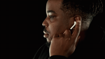 Man With Wireless Earbuds Finger In Ear GIF