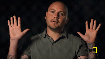 Man With Wrist Tattoo Hands In Air GIF