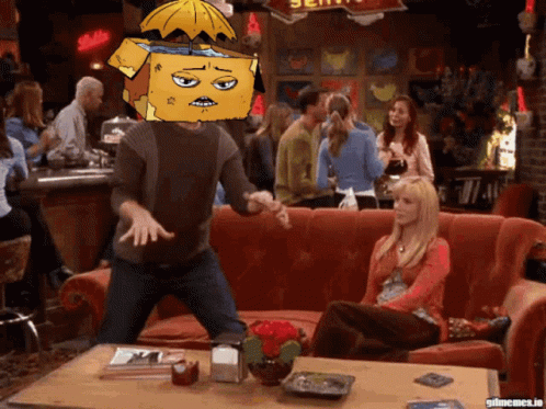 Man With Yellow Box On Head Dancing In Bar GIF