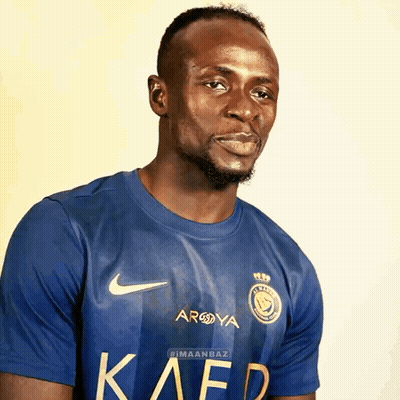 Man With Yellow Stripes On Soccer Field GIF