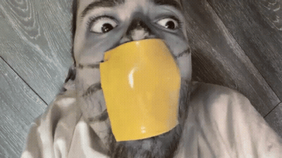 Man With Yellow Tape Around Mouth GIF