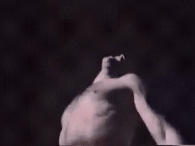 Man Without Shirt Dancing In Dark GIF