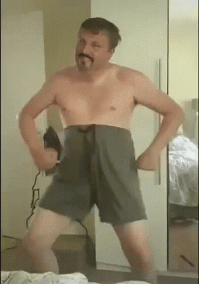 Man Without Shirt Dancing In Front Of Mirror GIF