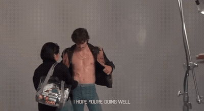 Man Without Shirt Held By Woman Saying I Hope You're Doing Well GIF