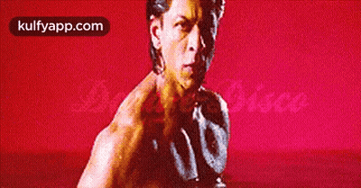 Man Without Shirt In Front Of Red Background Kulfyapp.com GIF