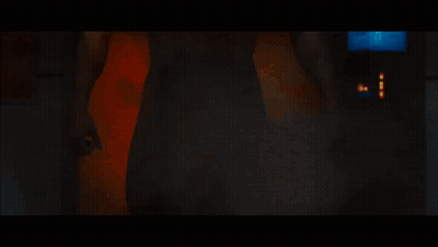 Man Without Shirt In Front Of Red Wall GIF