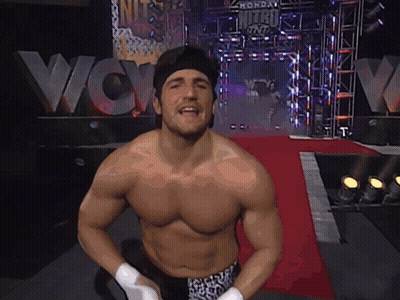 Man Without Shirt In Front Of WCW Sign GIF