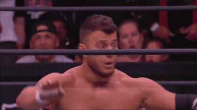 Man Without Shirt In Wrestling Ring With Crowd GIF