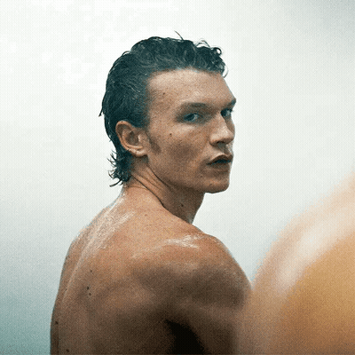 Man Without Shirt Looking At Camera GIF
