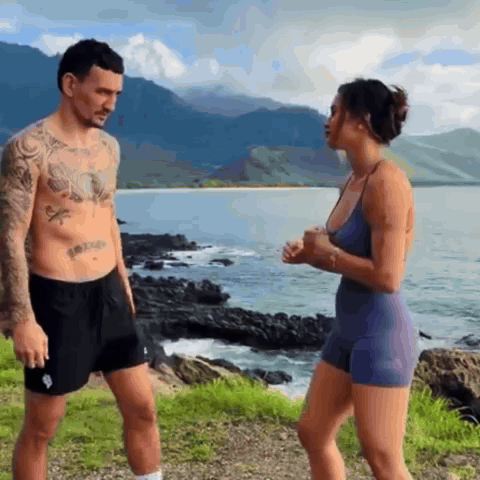 Man Without Shirt Next To Woman In Blue Tank Top GIF