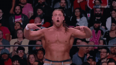 Man Without Shirt Pointing At Camera In Crowd GIF