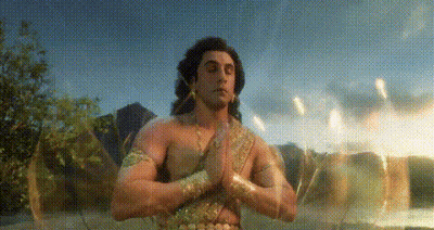 Man Without Shirt Praying By Lake GIF