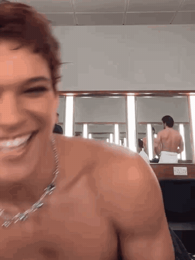 Man Without Shirt Smiling In Mirror GIF