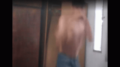 Man Without Shirt Standing Front Of Door GIF