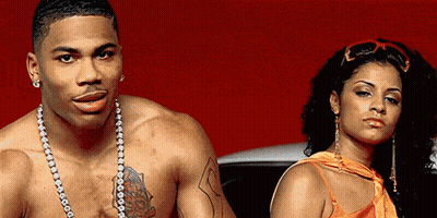 Man Without Shirt Standing Next To Woman GIF