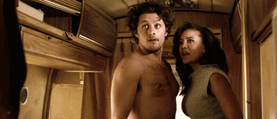 Man Without Shirt Standing Next To Woman GIF