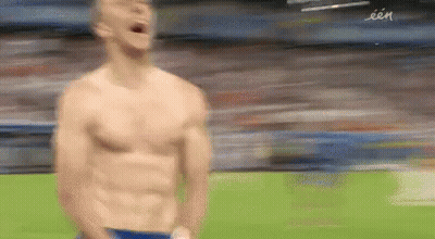 Man Without Shirt Standing On Soccer Field GIF