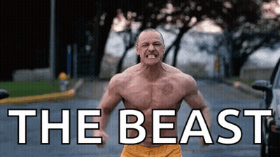 Man Without Shirt Standing On Street GIF