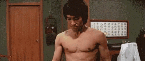 Man Without Shirt Standing With Arms Out GIF