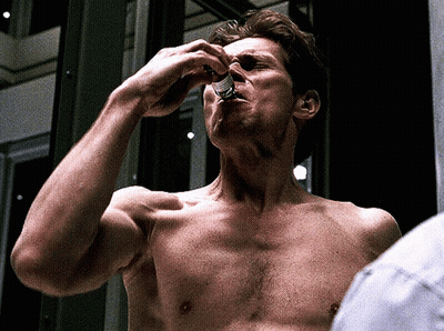 Man Without Shirt Taking Pill GIF