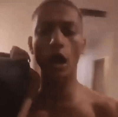 Man Without Shirt Taking Selfie GIF