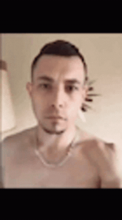 Man Without Shirt Taking Selfie With Necklace GIF