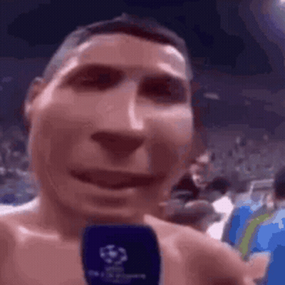Man Without Shirt Talking Into Microphone GIF