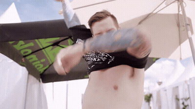 Man Without Shirt Under Umbrella Saying Normal GIF