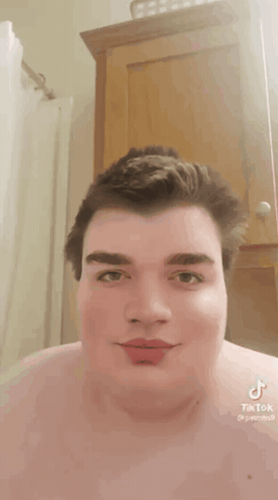 Man Without Shirt With TikTok On Chest GIF