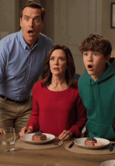 Man Woman And Boy Sitting At Table With Food Saying AI Slop GIF