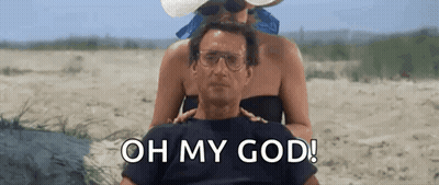 Man Woman On Beach Saying Oh My God GIF