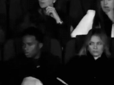 Man Woman Sitting In Black And White Theater GIF