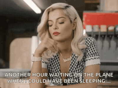 Man Woman Surrounded By Flowers With Foreign Writing GIF