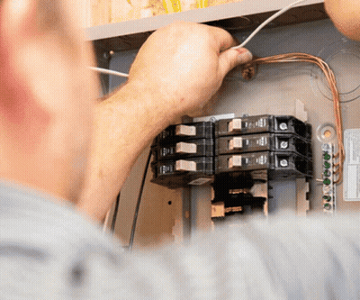 Man Working On Electrical Box Labeled Electrical GIF