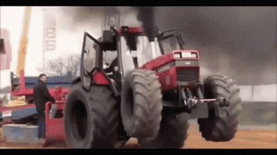 Man Working On Smoking Tractor GIF