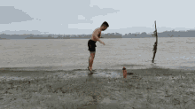 Man Working Out At Sea Side Burpee Exercise