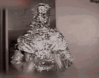 Man Wrapped In Tin Foil Holding Plate GIF