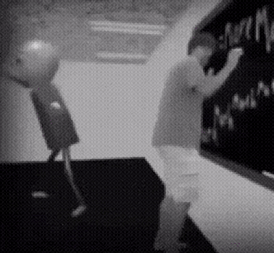 Man Writing On Blackboard With Robot GIF