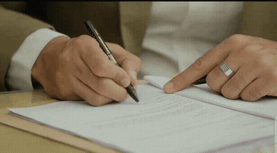 Man Writing On Paper With Ring GIF