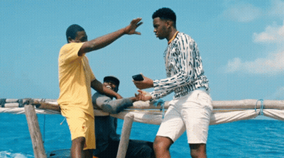 Man Yellow Shirt High Fives Man White Shorts GIF