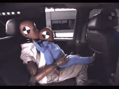 Mannequin In Suit And Tie Sitting In Back Seat Of Vehicle GIF