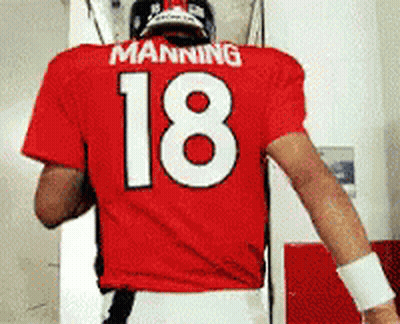 Manning Wearing A Red Jersey With The Number 18 On It GIF