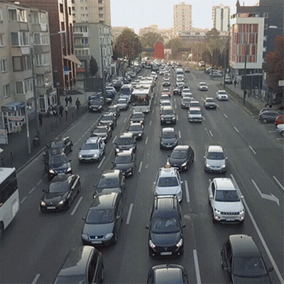 Many Cars Driving Down Street License Plate Starts With S GIF