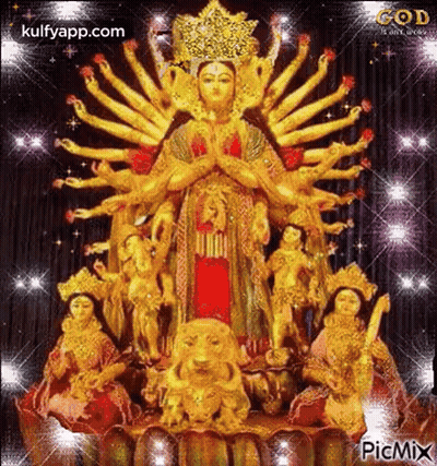 Many-Handed Woman Statue With Other Statues On Lotus GIF