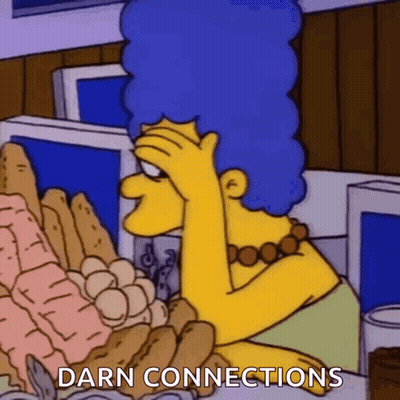 Marge Simpson Sitting At Table With Food Saying Darn Connections GIF