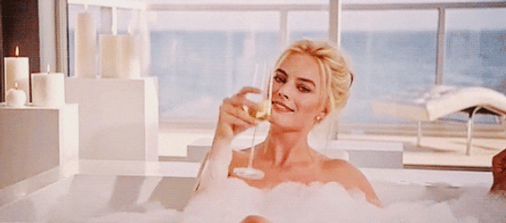 Margot Robbie Drinking Champagne And Enjoys Bubble Bath GIF