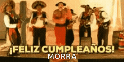 Mariachi Singers Playing Instruments On Stage GIF